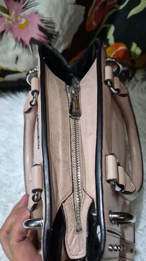 Balmain Paris Pink Leather Handbag with Studs (Category: Luxury Bags & Wallets) located in Baguio. Submitted by jhaz_bags (Listing ID 1469901809, Image 2). Description: - Authentic Balmain Paris handbag in a stunning pink leather - Structured design with dual top handles for easy carrying - Chic silver-tone hardware and edgy metal stud accents along the borders - Signature debossed logo stamp on the front panel - Secure zippered top closure and p