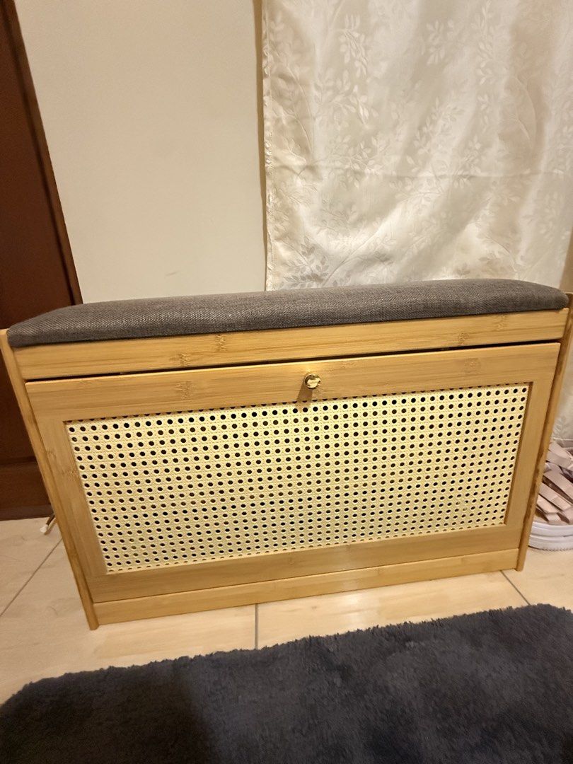 Bamboo Shoe Storage Bench with Padded Seat (Category: Shelves, Cabinets & Racks) located in Mandaluyong City. Submitted by riz_040521 (Listing ID 1469795817, Image 1). Description: - Material: Eco-friendly bamboo frame - Cushion: Comfortable grey upholstered top for seating - Storage: Flip-down compartment with interior shelving - Design: Stylish rattan-style patterned front panel - Function: Keeps your entryway neat and provides a comfortable sp