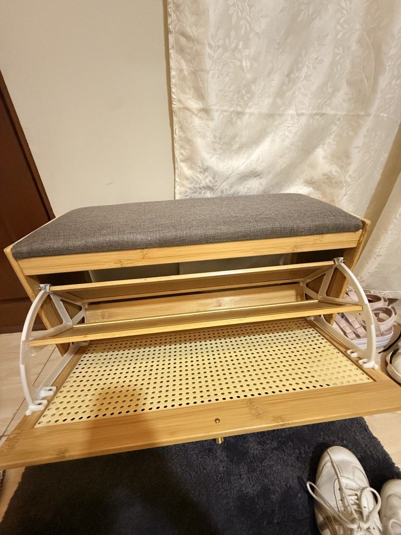 Bamboo Shoe Storage Bench with Padded Seat (Category: Shelves, Cabinets & Racks) located in Mandaluyong City. Submitted by riz_040521 (Listing ID 1469795817, Image 2). Description: - Material: Eco-friendly bamboo frame - Cushion: Comfortable grey upholstered top for seating - Storage: Flip-down compartment with interior shelving - Design: Stylish rattan-style patterned front panel - Function: Keeps your entryway neat and provides a comfortable sp