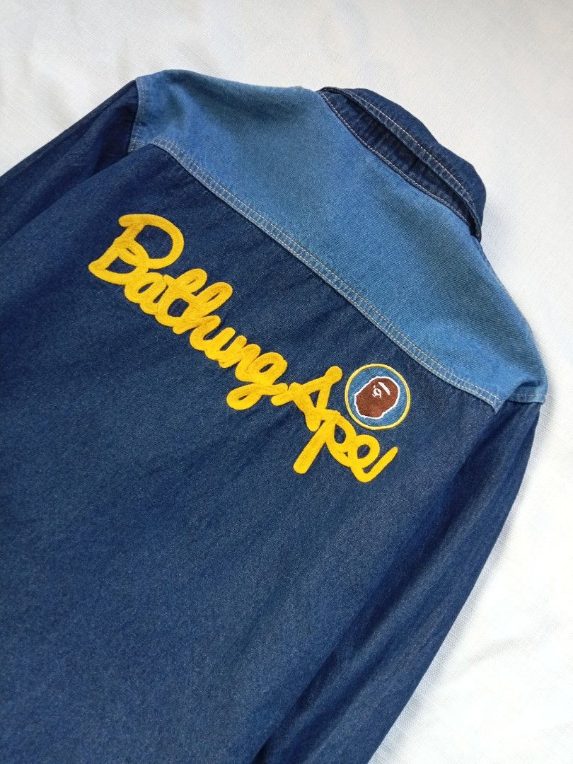 BAPE embroidery script utility denim jacket (Category: Coats, Jackets and Outerwear) located in Bagabag. Submitted by thrift_stories96 (Listing ID 1469928532, Image 3). Description: BAPE embroidery script utility denim jacket unisex Youth size but it can fits adult Small womens Xsmall mens Length - 23.5 Width - 19 Condition - 9/10 Color and cloth - 9.5/10 Flaw - missing 1 button sa lower part Need replacement if needed.