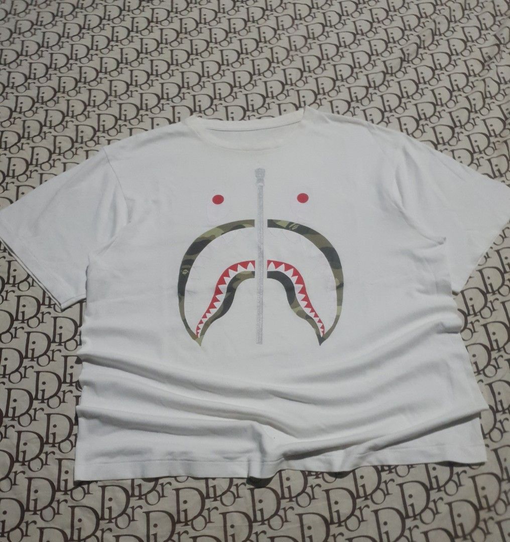 Bape Shark tshirt (Category: Tshirts & Polo Shirts ) located in San Fernando. Submitted by retro.district. (Listing ID 1469903238, Image 1). Description: - bape shark by a Bathing ape - Size: XL (23x27) - Condition: Excellent - Issue: cut neck tag - Color/print Rate: 9.5/10.