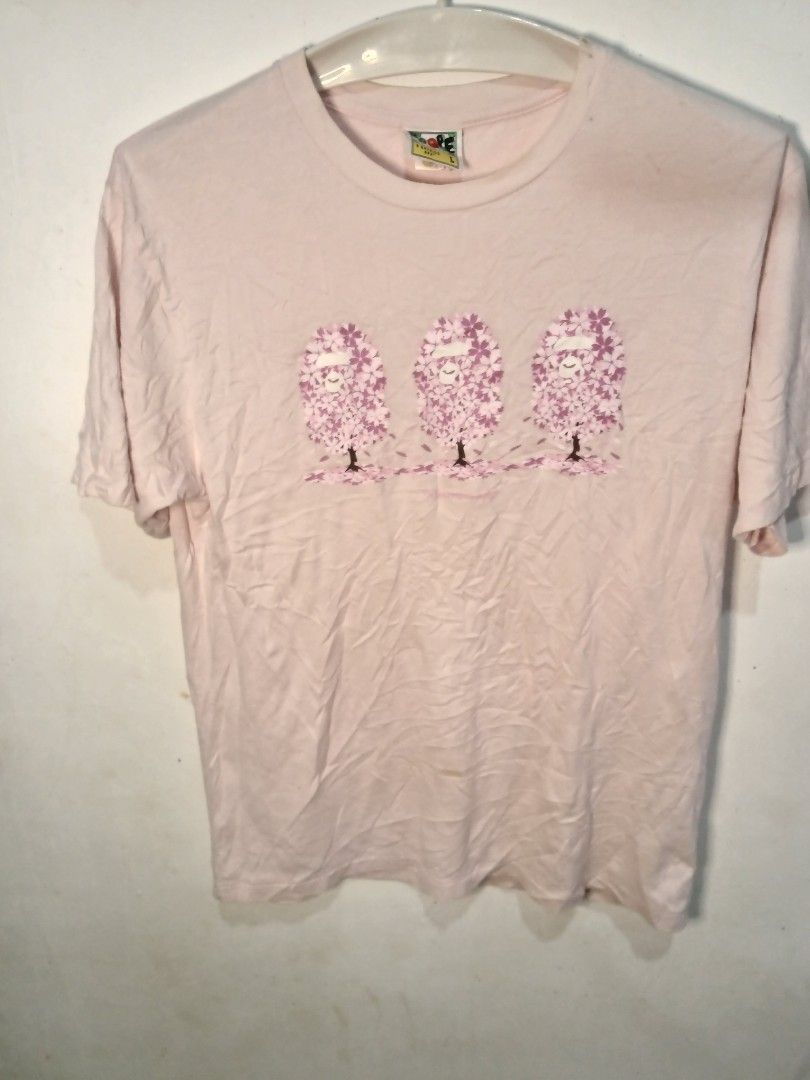 Bape x sakura blossom tee(authentic) (Category: Formal Shirts) located in San Jose. Submitted by garments17 (Listing ID 1469947131, Image 1). Description: - Brand: A Bathing Ape (BAPE) - Color: Pink - Size: L - Material: 100% cotton, Made in Japan - Design: Cherry blossom tree graphics on front, large BAPE floral-accented branding on back - Style: Casual crewneck - Condition: Excellent.