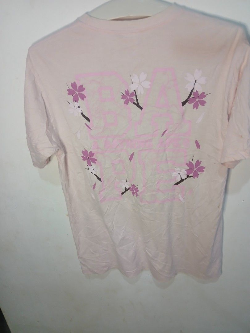 Bape x sakura blossom tee(authentic) (Category: Formal Shirts) located in San Jose. Submitted by garments17 (Listing ID 1469947131, Image 2). Description: - Brand: A Bathing Ape (BAPE) - Color: Pink - Size: L - Material: 100% cotton, Made in Japan - Design: Cherry blossom tree graphics on front, large BAPE floral-accented branding on back - Style: Casual crewneck - Condition: Excellent.