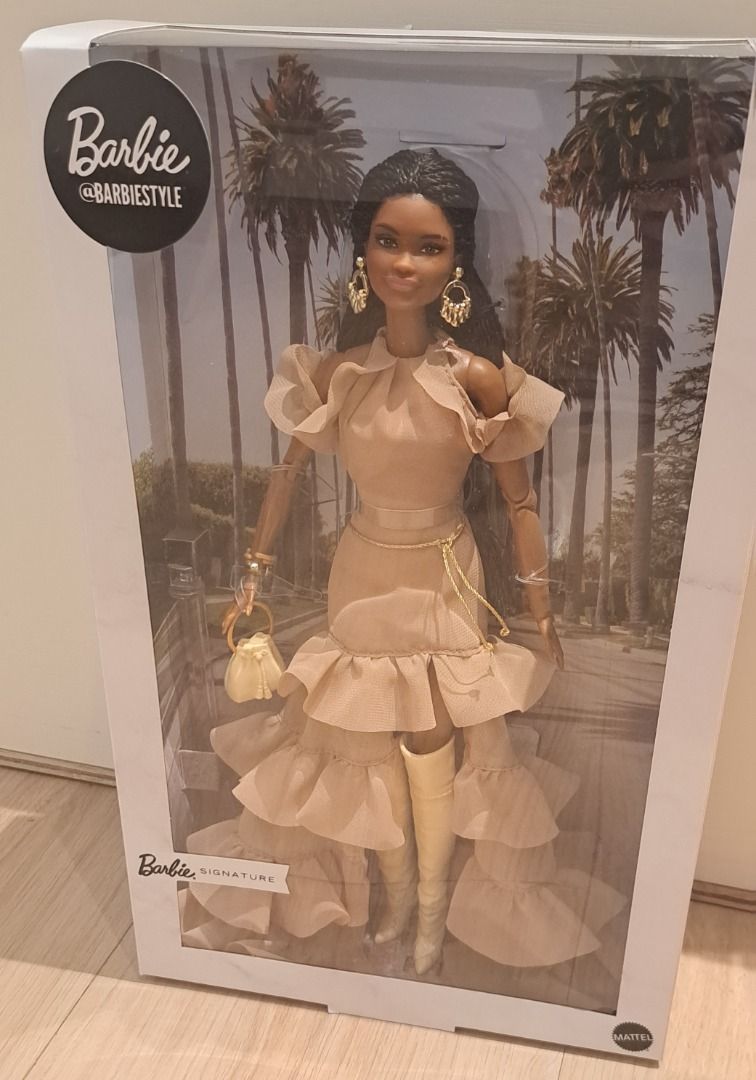 Barbie Signature BarbieStyle Boho Chic Doll NRFB (Category: Kids Toys) located in Muntinlupa City. Submitted by sun8752 (Listing ID 1469773541, Image 3). Description: - Authentic Barbie Signature Brooklyn doll from the exclusive BarbieStyle collection - Stunning dark braided hair and fashionable ruffled beige dress with matching boots - Complete with stylish gold dangling earrings, a chain belt, and a mini handbag - Eye-catching box featuring pal