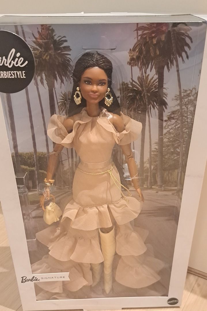 Barbie Signature BarbieStyle Boho Chic Doll NRFB (Category: Kids Toys) located in Muntinlupa City. Submitted by sun8752 (Listing ID 1469773541, Image 1). Description: - Authentic Barbie Signature Brooklyn doll from the exclusive BarbieStyle collection - Stunning dark braided hair and fashionable ruffled beige dress with matching boots - Complete with stylish gold dangling earrings, a chain belt, and a mini handbag - Eye-catching box featuring pal