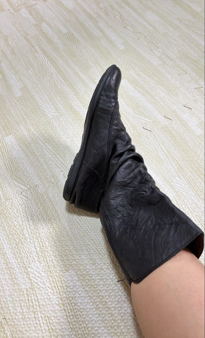 Bata Black Slouchy Mid-Calf Flat Boots (Category: Boots) located in Quezon City. Submitted by marifavo (Listing ID 1469825254, Image 1). Description: - Brand: Bata - Style: Black mid-calf boots with easy slip-on fit - Details: Soft slouchy upper featuring stylish side metallic buttons - Soles: Flat soles with good grip texture underneath - Condition: Normal signs of wear on soles and leather surface from regular use.