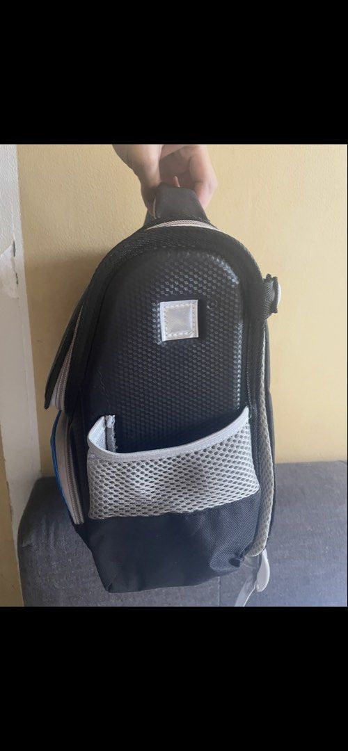 Batman Kids School Backpack with Hard Shell Front (Category: Babies & Kids Fashion) located in Manila. Submitted by zealturtle_0fa233 (Listing ID 1469925449, Image 3). Description: Batman school backpack for young fans. Hard shell front pocket with classic yellow bat logo and graphic action scene on the top flap. Black and grey color scheme with mesh side pockets for water bottles. Padded adjustable shoulder straps and top carry handle. Mesh padd