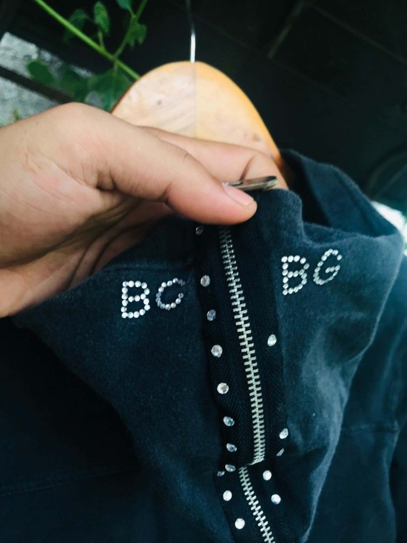 BCBGeneration Rhinestone Black Zip-Up Hoodie (Category: Coats, Jackets and Outerwear) located in Camiling. Submitted by akosiano (Listing ID 1469840409, Image 2). Description: - Brand: BCBGeneration - Style: Zip-up hoodie with classic Y2K rhinestone logo and zipper strip - Size: Medium - Features: Front pockets, branded metal pull - Origin: Made in Indonesia - Condition: Great casual wear.