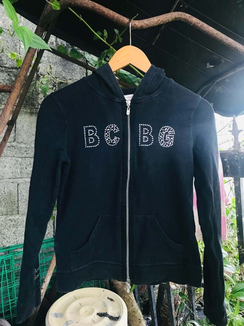 BCBGeneration Rhinestone Black Zip-Up Hoodie (Category: Coats, Jackets and Outerwear) located in Camiling. Submitted by akosiano (Listing ID 1469840409, Image 1). Description: - Brand: BCBGeneration - Style: Zip-up hoodie with classic Y2K rhinestone logo and zipper strip - Size: Medium - Features: Front pockets, branded metal pull - Origin: Made in Indonesia - Condition: Great casual wear.