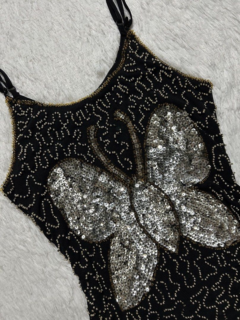 Beaded butterfly sleeveless fitted top (Category: Sleeveless) located in Quezon City. Submitted by herarchiveph (Listing ID 1469894144, Image 3). Description: Beaded butterfly sleeveless fitted top Cut tag Bust: 28 Inches (stretchable) Length: 21 Inches - In good condition - Has sign of used - missing bead .