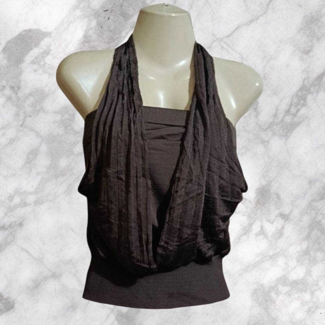 bebe Brown Halter Neck Top Size S (Category: Sleeveless) located in Paranaque City. Submitted by calm_youngstore7 (Listing ID 1469770613, Image 1). Description: - Brand: bebe - Size: Small - Color: Brown - Condition: Brand new with original tag attached - Design: Halter top with attached draped scarf detail around the neck and front - Hem: Fitted ribbed bottom hem - Material: Soft fabric with a strapless base layer.