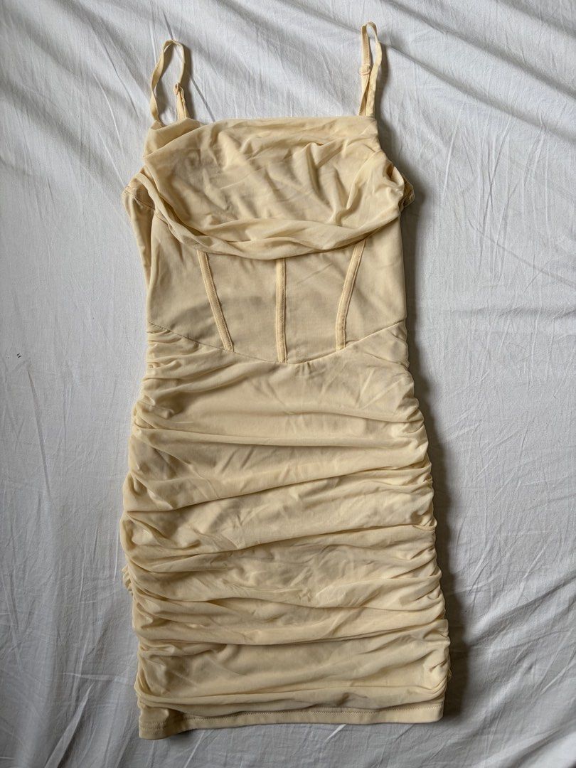 Beige Bodycon Corset Mini Spaghetti Strap Dress (Category: Dresses) located in Quezon City. Submitted by vidadmarie (Listing ID 1469825637, Image 2). Description: - Color: Beige - Style: Bodycon mini dress - Design: Cowl neckline and corset-style bodice with boning details - Worn once for an event.