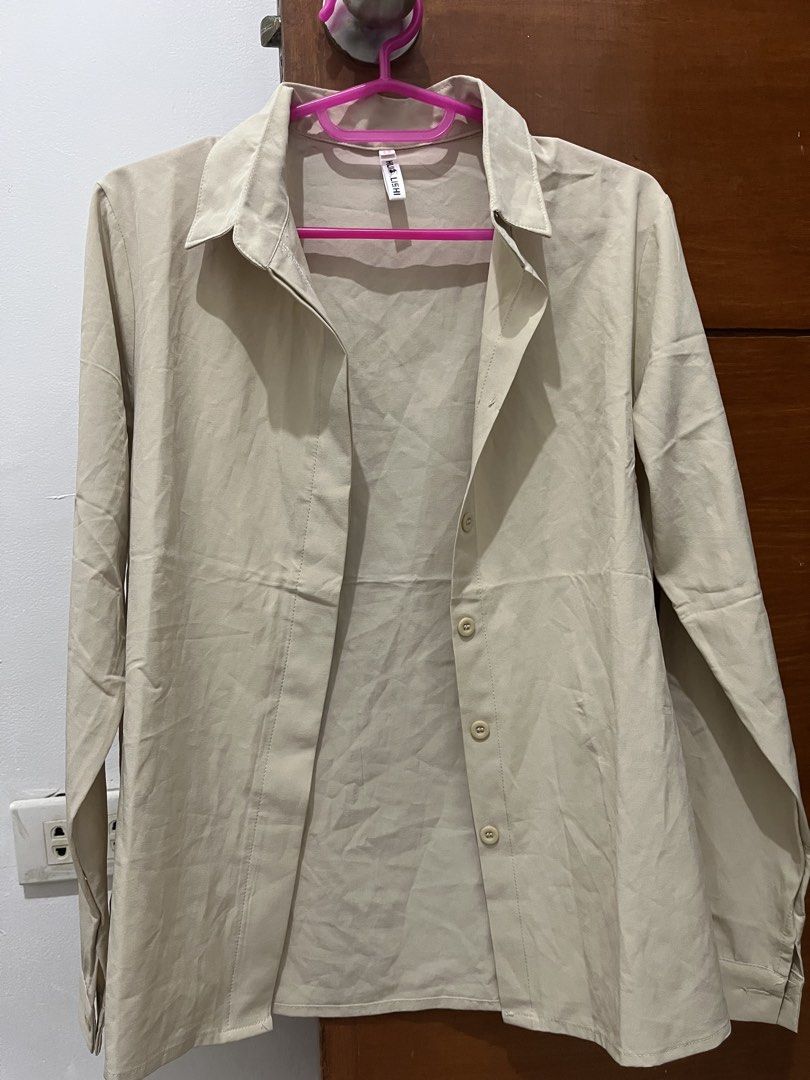 Beige Long Sleeve Button Down Shirt (Category: Longsleeves) located in Manila. Submitted by thepinkshop_ (Listing ID 1469885083, Image 1). Description: - Color: Classic Neutral Beige - Style: Long sleeves with front button closure and collared neck - Fit: Standard fit - Fabric: Lightweight and breathable, perfect for layering or wearing solo - Condition: Brand new/Excellent (Ready to ship).