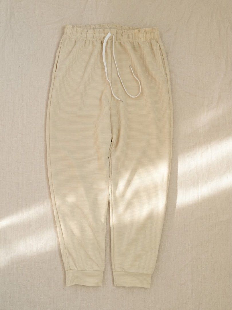 Beige ribbed sweatpants joggers with drawstring (Category: Joggers) located in Lipa City. Submitted by collbyisidora (Listing ID 1469902329, Image 1). Description: - Color: Beige - Style: Casual / Loungewear - Material: Soft textured ribbed fabric with fine horizontal lines - Waistband: Elastic with white adjustable drawstring - Cuffs: Ribbed at the ankles - Condition: Brand new / Excellent.
