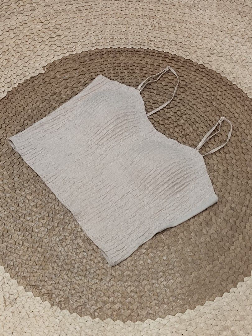 Beige Textured Padded Camisole Tank Top (Category: Sleeveless) located in San Juan City. Submitted by rhennx (Listing ID 1469857704, Image 1). Description: 📌Small - Semi Med 📌Color: Cream 📌Padded (built in) 📌 Adjustable stap 📌 Textured front, seamless back NO ISSUE.