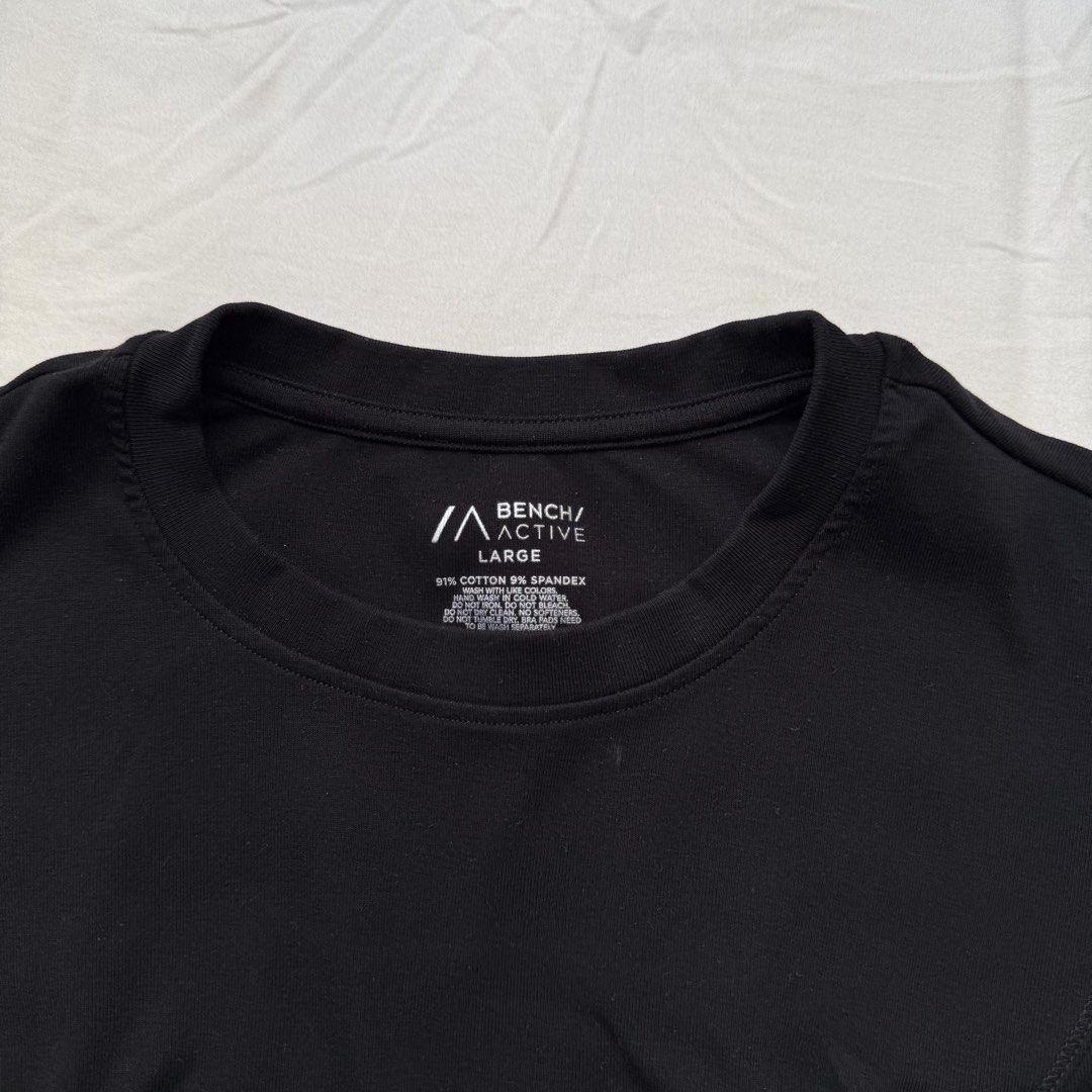 Bench Active Black Cropped Top Size Large (Category: Activewear) located in Pasig City. Submitted by notshynotmeee (Listing ID 1469809800, Image 2). Description: - Brand: Bench Active - Color: Solid black - Size: Large - Material: 91% cotton, 9% spandex - Fit: Cropped - Design: Crew neckline with flattering front princess seams Best fits M for loose fit.