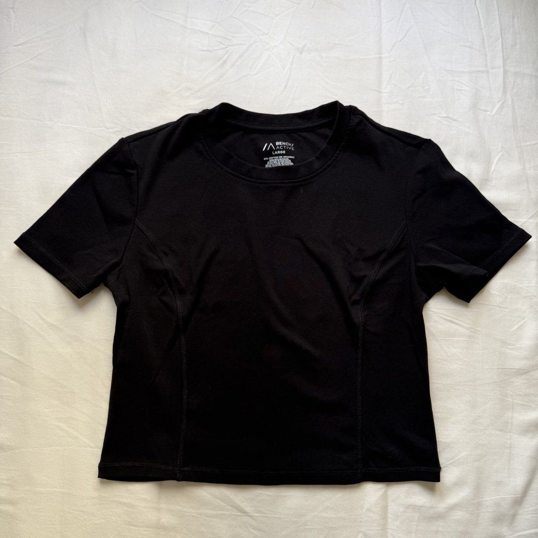 Bench Active Black Cropped Top Size Large (Category: Activewear) located in Pasig City. Submitted by notshynotmeee (Listing ID 1469809800, Image 1). Description: - Brand: Bench Active - Color: Solid black - Size: Large - Material: 91% cotton, 9% spandex - Fit: Cropped - Design: Crew neckline with flattering front princess seams Best fits M for loose fit.