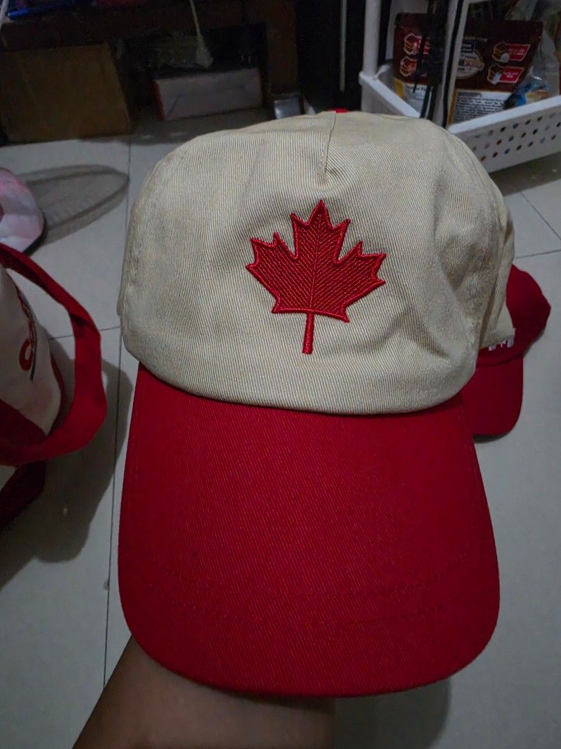 Bench Canada Heritage Two-Tone Baseball Cap (Cream/Red) (Category: Caps & Hats) located in Calamba. Submitted by stuffsbysaz (Listing ID 1469910688, Image 2). Description: Size: OSFM (One Size Fits Most) - Adjustable via fabric strap closure Product Details: • Brand: Bench (Official Bench Canada merchandise) • Design: Two-tone aesthetic featuring a cream-colored crown panel paired with a vibrant red flat brim/visor. • Front Details: High-quality,