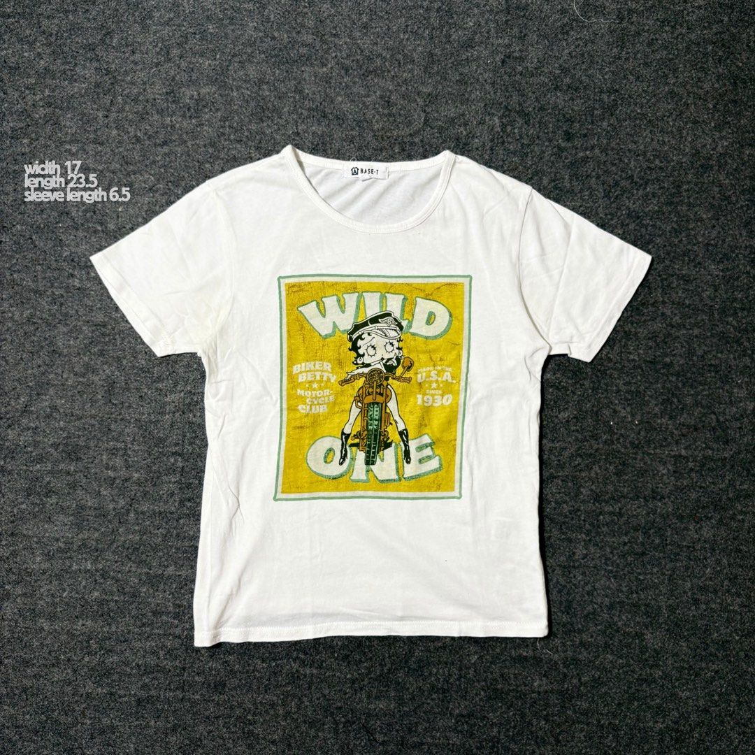 Betty Boop “Wild One” Tee (Category: Tshirts & Polo Shirts ) located in Mabalacat. Submitted by alternativegooods (Listing ID 1469859482, Image 1). Description: MEASUREMENTS (inches) ⌗ width 17 ⌗ length 23.5 ⌗ sl 6.5 ★ Color may vary slightly due to lighting. ★ Manage your expectations, these are pre-loved/thrifted items. ★ Ship via J&T Express & Lalamove..