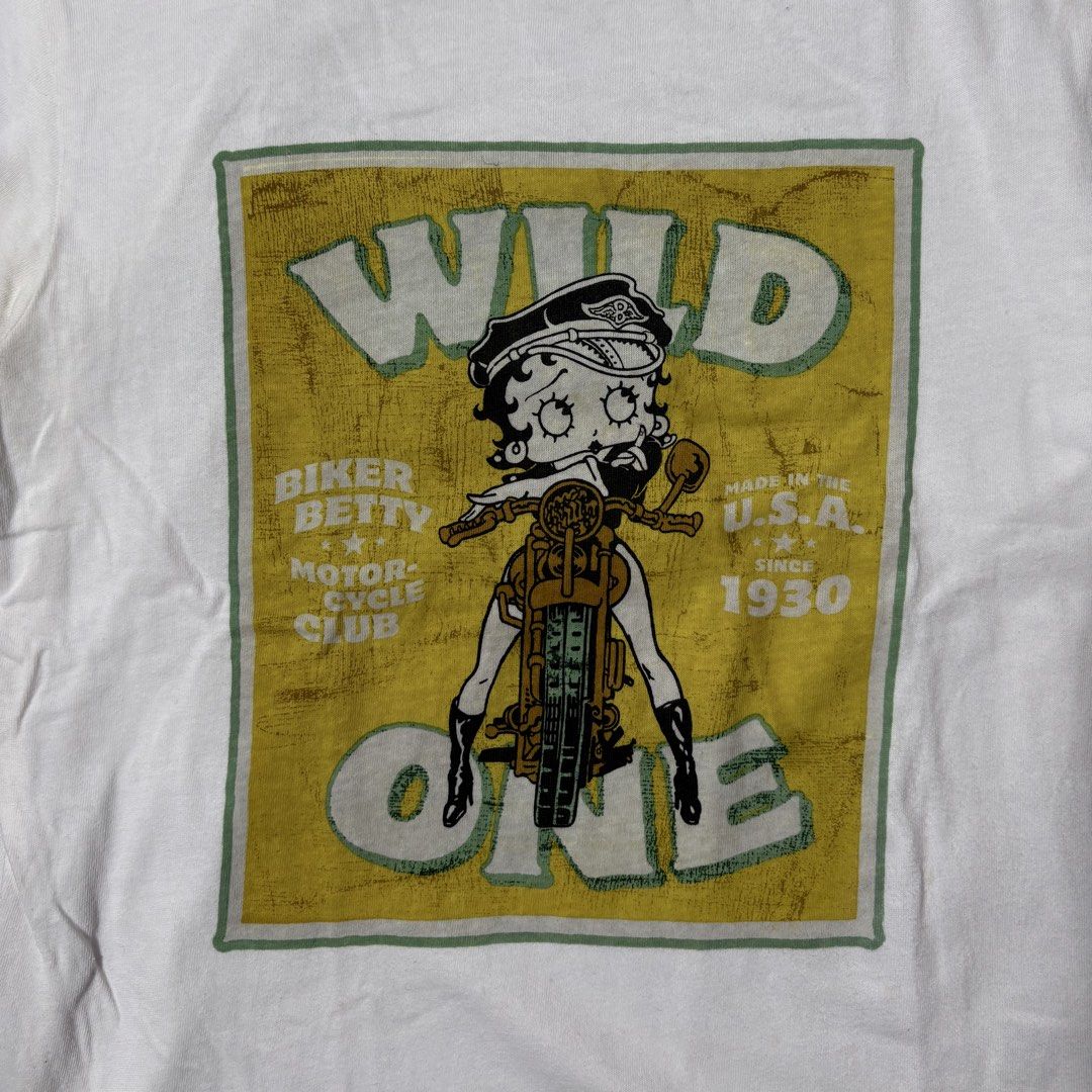 Betty Boop “Wild One” Tee (Category: Tshirts & Polo Shirts ) located in Mabalacat. Submitted by alternativegooods (Listing ID 1469859482, Image 2). Description: MEASUREMENTS (inches) ⌗ width 17 ⌗ length 23.5 ⌗ sl 6.5 ★ Color may vary slightly due to lighting. ★ Manage your expectations, these are pre-loved/thrifted items. ★ Ship via J&T Express & Lalamove..