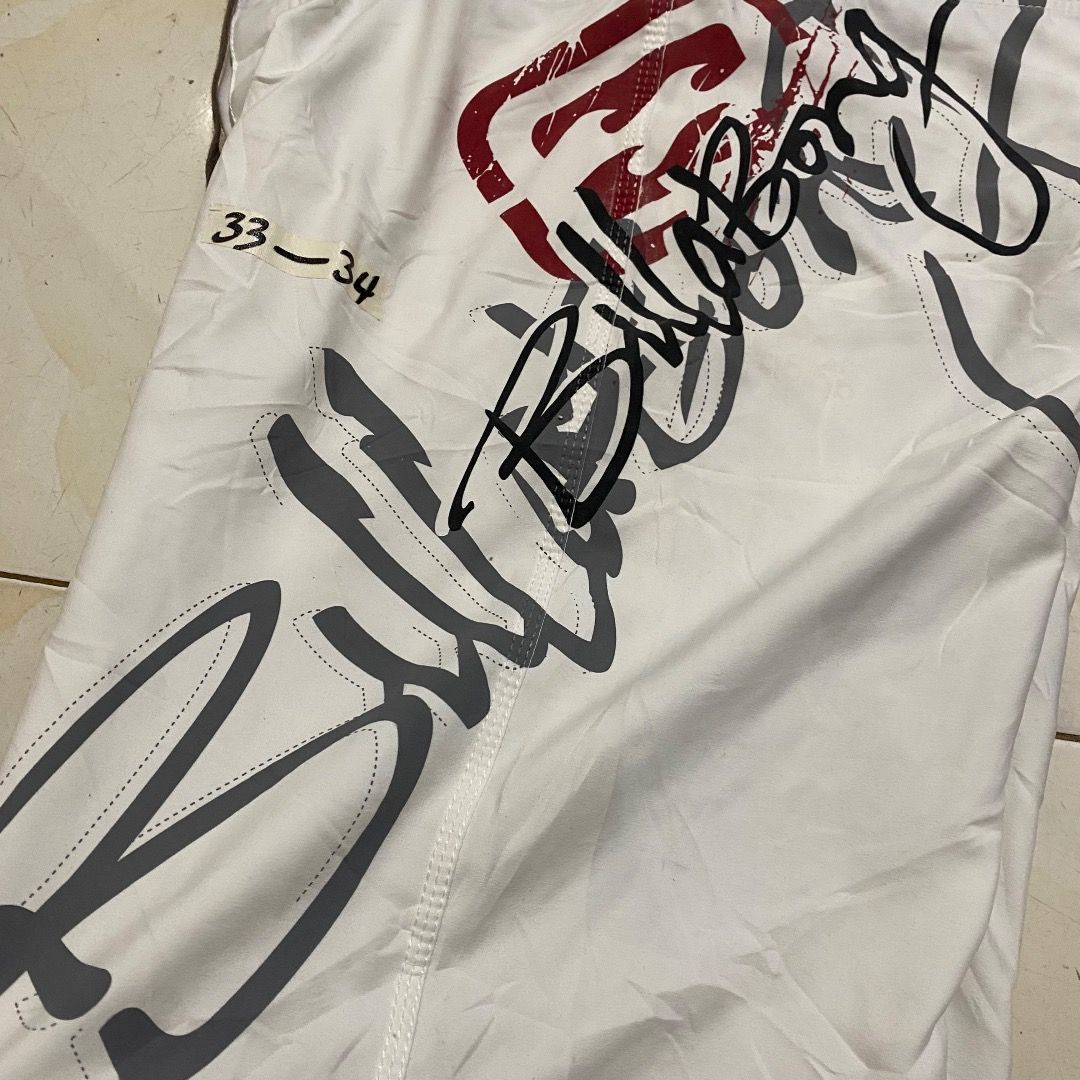 Billabong Boardshorts White Size 34 (Category: Swim Trunks & Board Shorts) located in Bacolod City. Submitted by jeybe112019 (Listing ID 1469893081, Image 3). Description: - Brand: Billabong - Size: 34 - Color: White with large grey and red logo graphics - Material: 100% polyester - Features: Velcro fly with front lace tie and right-side cargo pocket - Origin: Made in China - Condition: Excellent pre-owned condition.