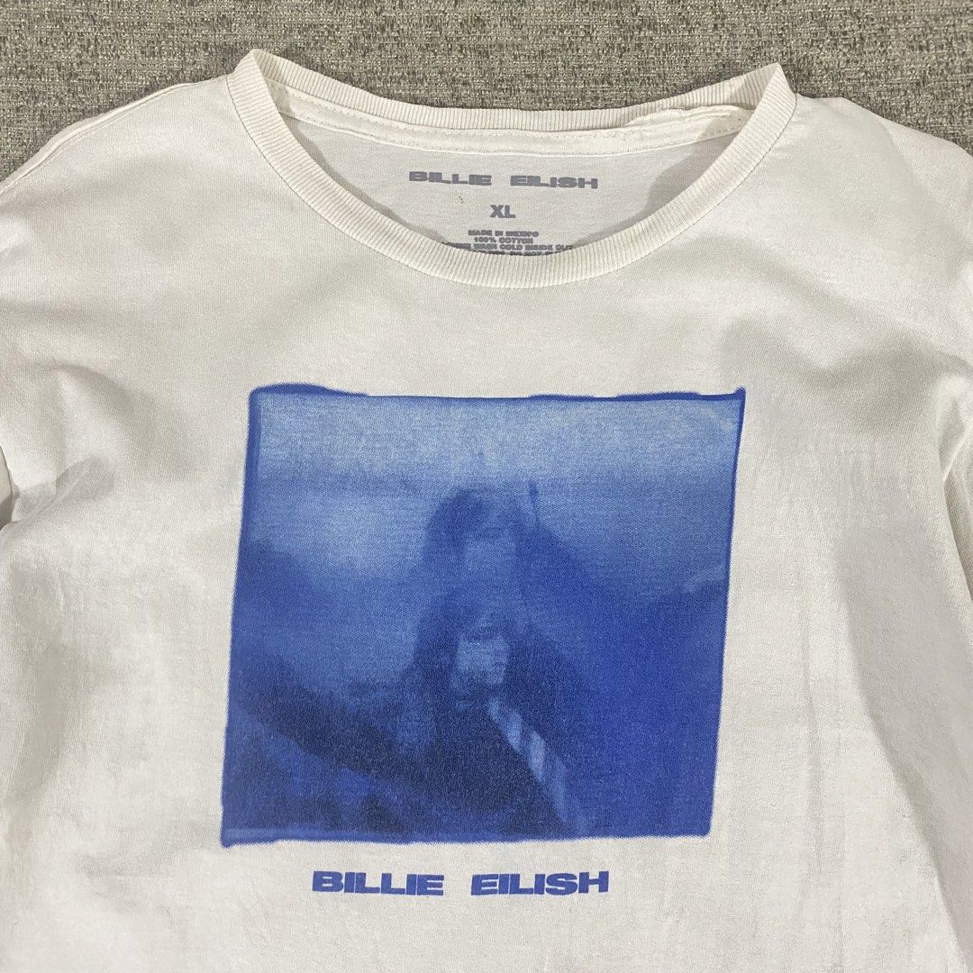 Billie Eilish Official Merch T-shirt (Category: Shirts) located in Los Banos. Submitted by adothrift (Listing ID 1469853721, Image 3). Description: Billie Eilish Official Merch T-shirt Size: S-M Dimensions: Width - 18 Length - 26 .