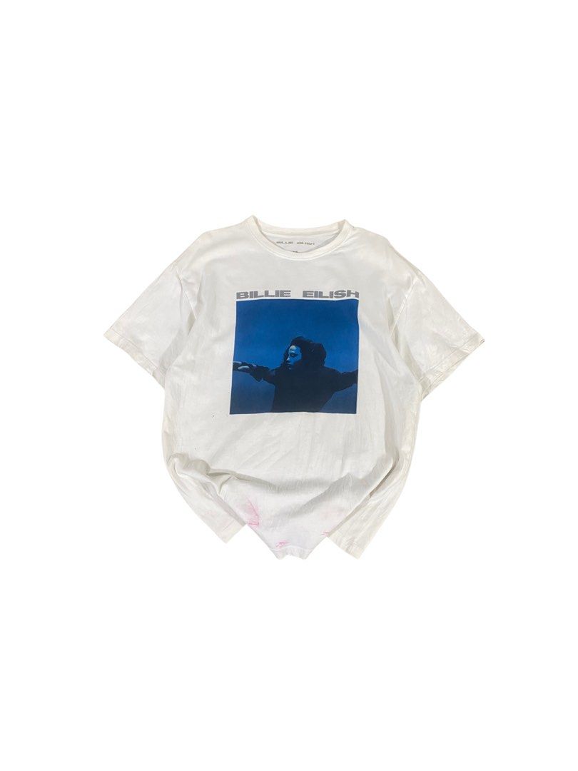 Billie Eilish Official Merch T-shirt (Category: Shirts) located in Los Banos. Submitted by adothrift (Listing ID 1469854044, Image 1). Description: Billie Eilish Official Merch T-shirt Size: M-L Dimensions: Width - 19 Length - 26.