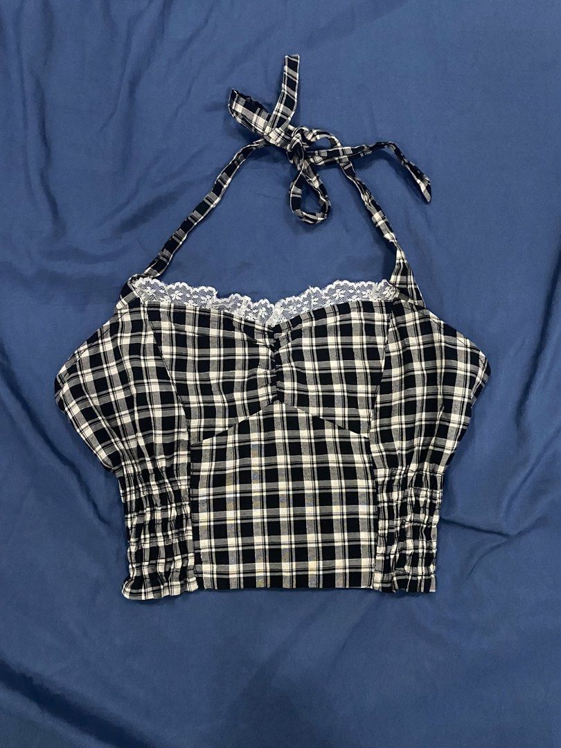 Black and White Plaid Halter Crop Top Size S (Category: Sleeveless) located in Manila. Submitted by escherichiaa (Listing ID 1469803896, Image 1). Description: - Color/Pattern: Black and white plaid - Size: S (tag attached) - Design: Halter neck, lace-trimmed sweetheart neckline, decorative front buttons - Fit: Smocked and stretchy body - Fabric: Lightweight, ideal for warm weather - Styling: Perfect to pair with high-waisted denim shorts or skir