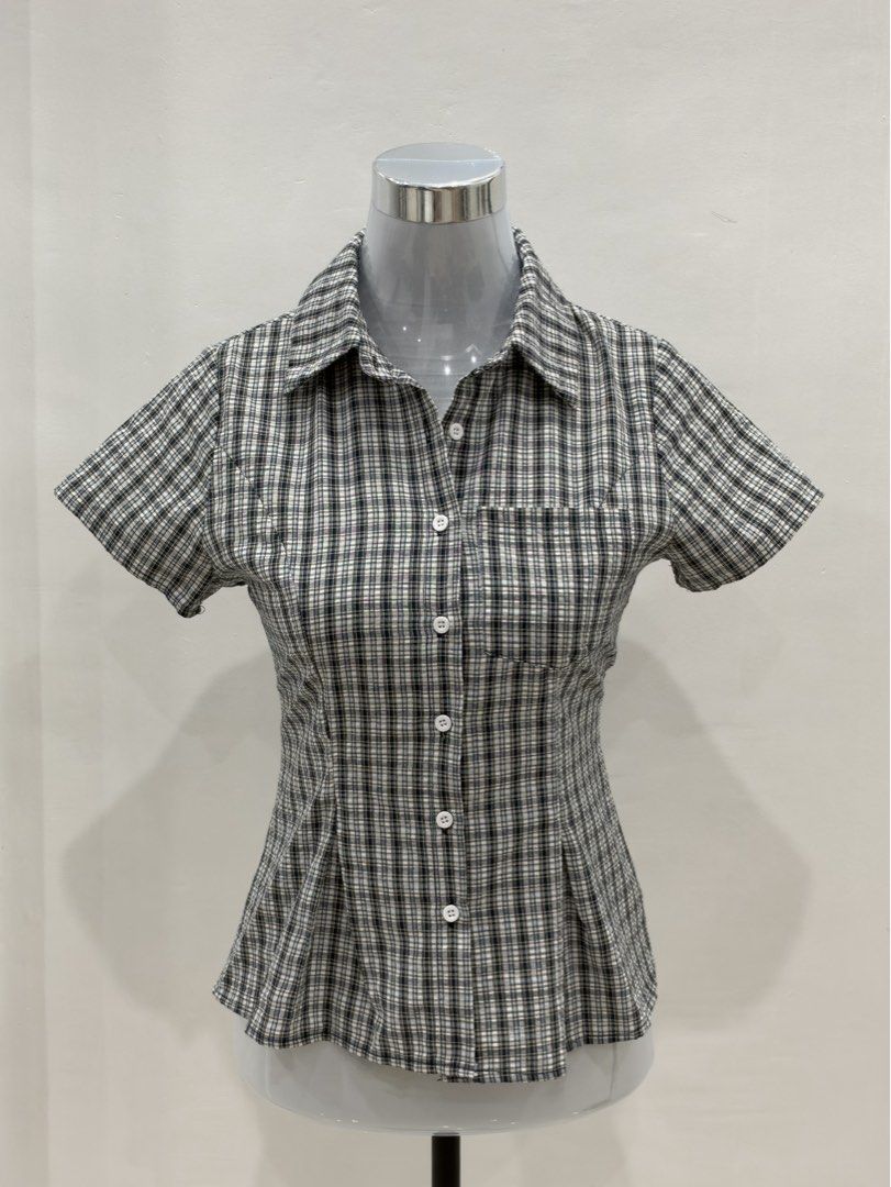 Black and white plaid short sleeve button up blouse (Category: Blouses) located in Mandaluyong City. Submitted by jaimierouu (Listing ID 1469881803, Image 1). Description: Fits small to medium.