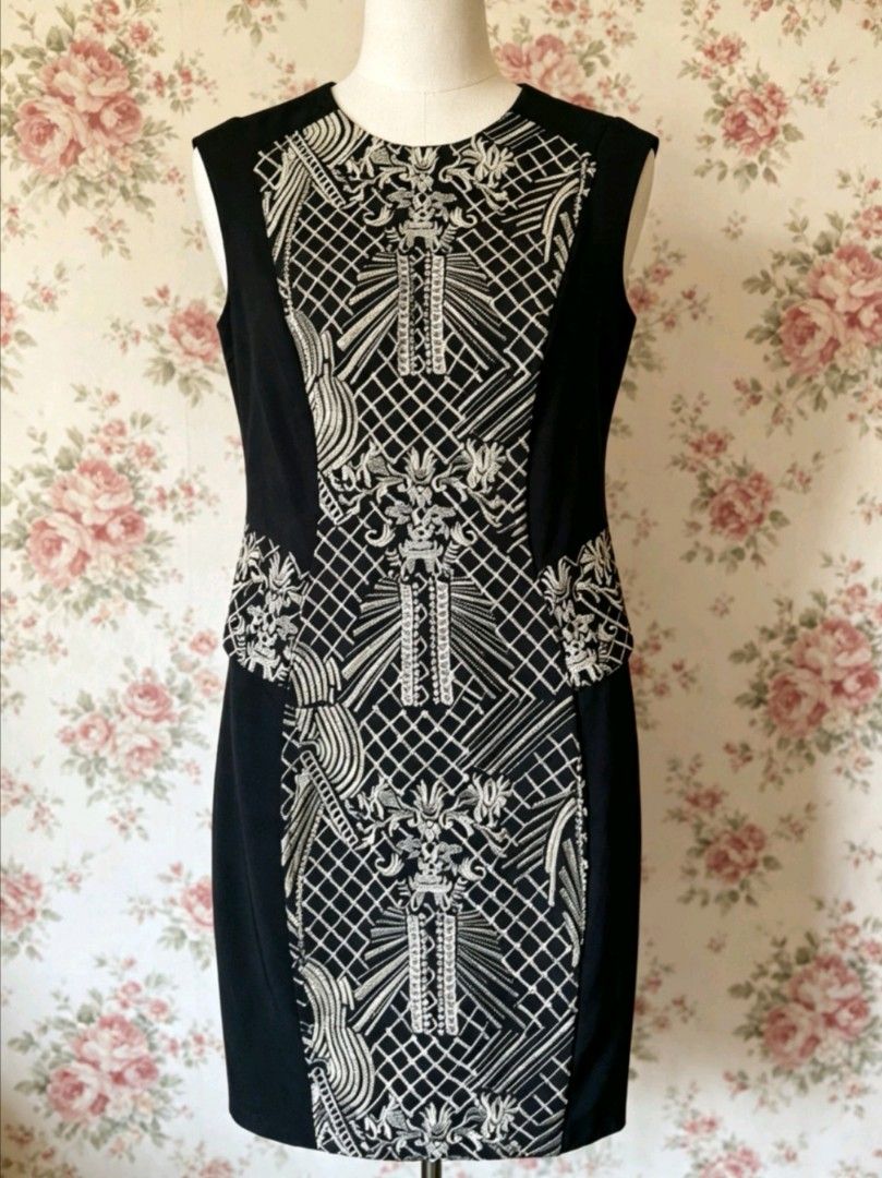 Black and White Reversible Pattern Sleeveless Dress (Category: Dresses) located in Manila. Submitted by charlottej01596 (Listing ID 1469809031, Image 2). Description: - Style: 2-in-1 reversible sleeveless dress - Cut: Knee-length sheath - Side A: Solid black front with patterned waistband and V-neck - Side B: Bold geometric and floral embroidered panel with crew neck - Benefit: Two completely different looks in one versatile piece.