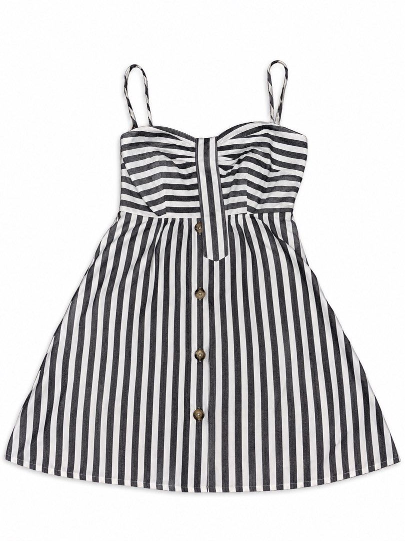 Black and white striped button-front cami dress (Category: Dresses) located in Marikina City. Submitted by ziaziaaa (Listing ID 1469894157, Image 1). Description: - Pattern: Black and white vertical stripes - Design: Sweetheart neckline, thin spaghetti straps, gathered bust - Details: Functional brown front buttons with center stripe accent - Cut: Flared A-line silhouette, above the knee length - Fabric: Lightweight and breathable, perfect for wa