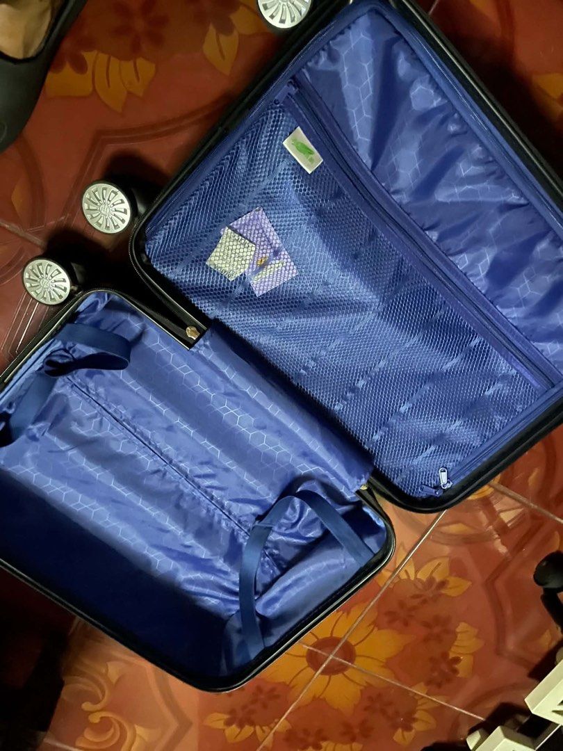 Black Hardside Spinner Luggage 4-Wheel Suitcase (Category: Luggage) located in Manila. Submitted by sachi_xx (Listing ID 1469821479, Image 2). Description: - Ready for takeoff. Grab it before your next flight! - Pre-loved luggage, ready for new stamps on the passport. - Pack light. Travel far. • Condition: lightly used (bought from Taiwan on April 2025), handle refuses to slide up or down on the 1st level smoothly, built-in lock/TSA lock no longe