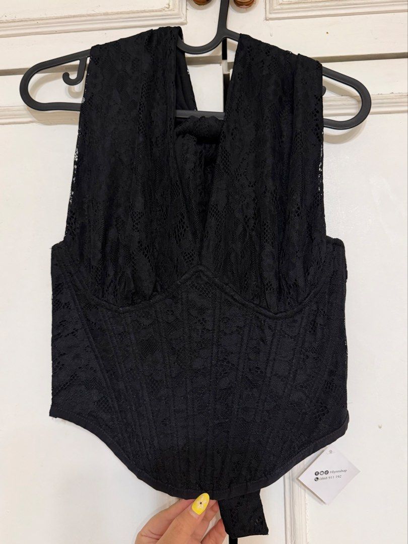Black lace halter bodysuit corset style (Category: Sleeveless) located in Rizal. Submitted by rianaht (Listing ID 1469932402, Image 1). Description: - Color & Style: Black lace bodysuit with trendy halter neck styling - Design: Structured corset-style bodice with a flattering pointed hemline - Details: All-over floral lace overlay on the front and back - Closure: Convenient side zipper closure - Fit: Attached bottom piece for a seamless one-piece