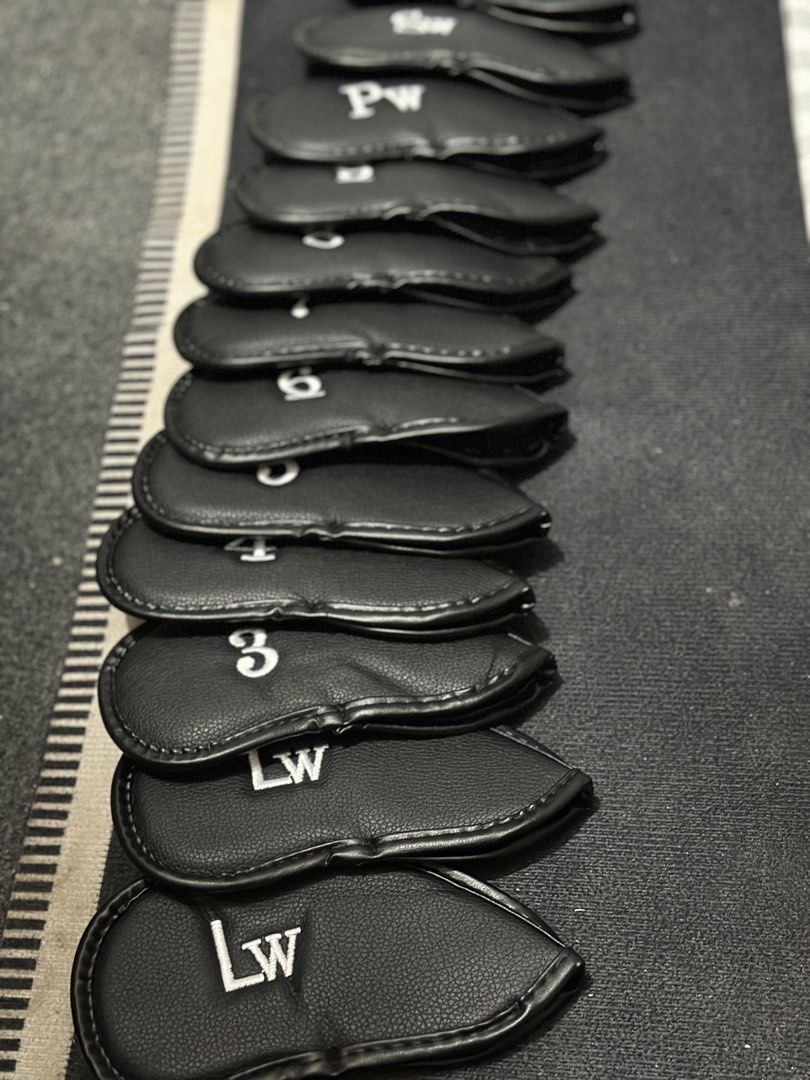 Black Leather Golf Iron Head Covers Set (Category: Golf) located in Manila. Submitted by cnmanaois19234 (Listing ID 1469892066, Image 3). Description: - Complete set of 12 black synthetic leather golf iron head covers - Includes numbers 3 through 9, plus Pitching Wedge (Pw), Approach Wedge (Aw), and two Lob Wedges (Lw) - Stylish white embroidered lettering for easy club identification - Protects your valuable clubs from scratches, dings, and dama