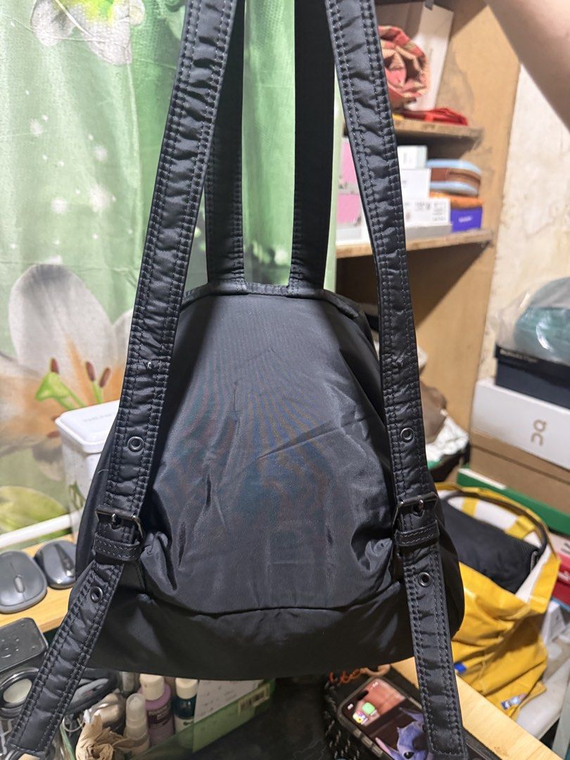 SONIA RYKIEL Backpack with Gold Zippers (Category: Backpacks) located in Opol. Submitted by great_finds_kollexion (Listing ID 1469879492, Image 2). Description: - Color: Classic Black - Material: Lightweight, durable nylon - Closure: Flap top with drawstring - Pockets: Two exterior zippered front pockets with gold-tone chain pull charms - Straps: Adjustable with buckle details - Condition: Clean interior and exterior, ready for use - Ideal for: D