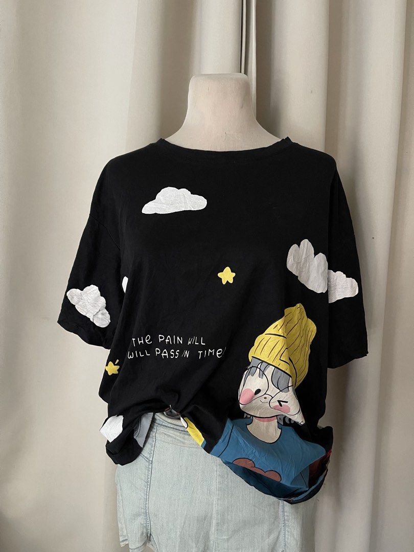 Black Oversize with Cloud and Anime Print (Category: Shirts) located in Cainta. Submitted by zlove111 (Listing ID 1469771617, Image 2). Description: - Color: Black - Fit: Oversized / Relaxed fit - Design: Cute cartoon art with yellow beanie, stars, clouds, and "THE PAIN WILL PASS IN TIME?" text - Sleeves: Short sleeves - Style Tip: Easy to pair with jeans or skirts - Condition: 8.5/10 last price up to xl .