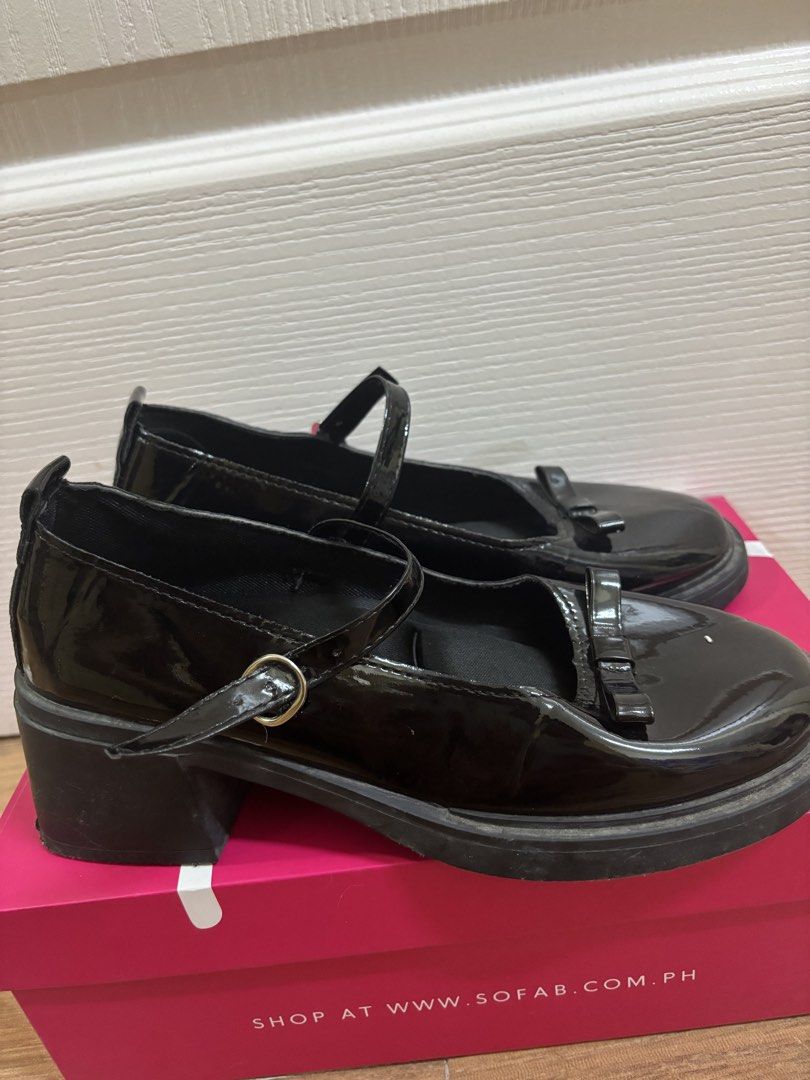Black Patent Mary Jane Platform Heels with Bow (Category: Heels) located in Manila. Submitted by vegajhasse57128 (Listing ID 1469893166, Image 2). Description: - Style: Black patent Mary Jane flats/heels - Heel Height: Around 2 inches (chunky block heel for stability) - Closure: Strap with metal buckle across the top - Details: Adorable small bow on the rounded toe Deal Details & Delivery Location / Pickup: Pasig / Metro Manila Shipping/Delivery: