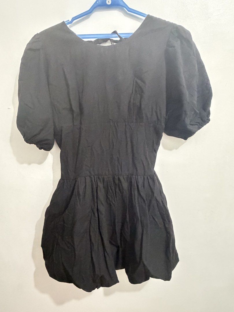Black Puff Sleeve Bubble Dress Mini two way (Category: Dresses) located in Cainta. Submitted by selltimentalshop (Listing ID 1469932734, Image 2). Description: - Color: Classic Black - Sleeves: Trendy puff sleeves - Waist: Comfortable smocked elastic waistband - Design: Voluminous bubble skirt hem - Closure: Cute back tie near the neckline - Versatility: Perfect for casual outings and dates - Condition: Excellent Condition No issue Twice used onl