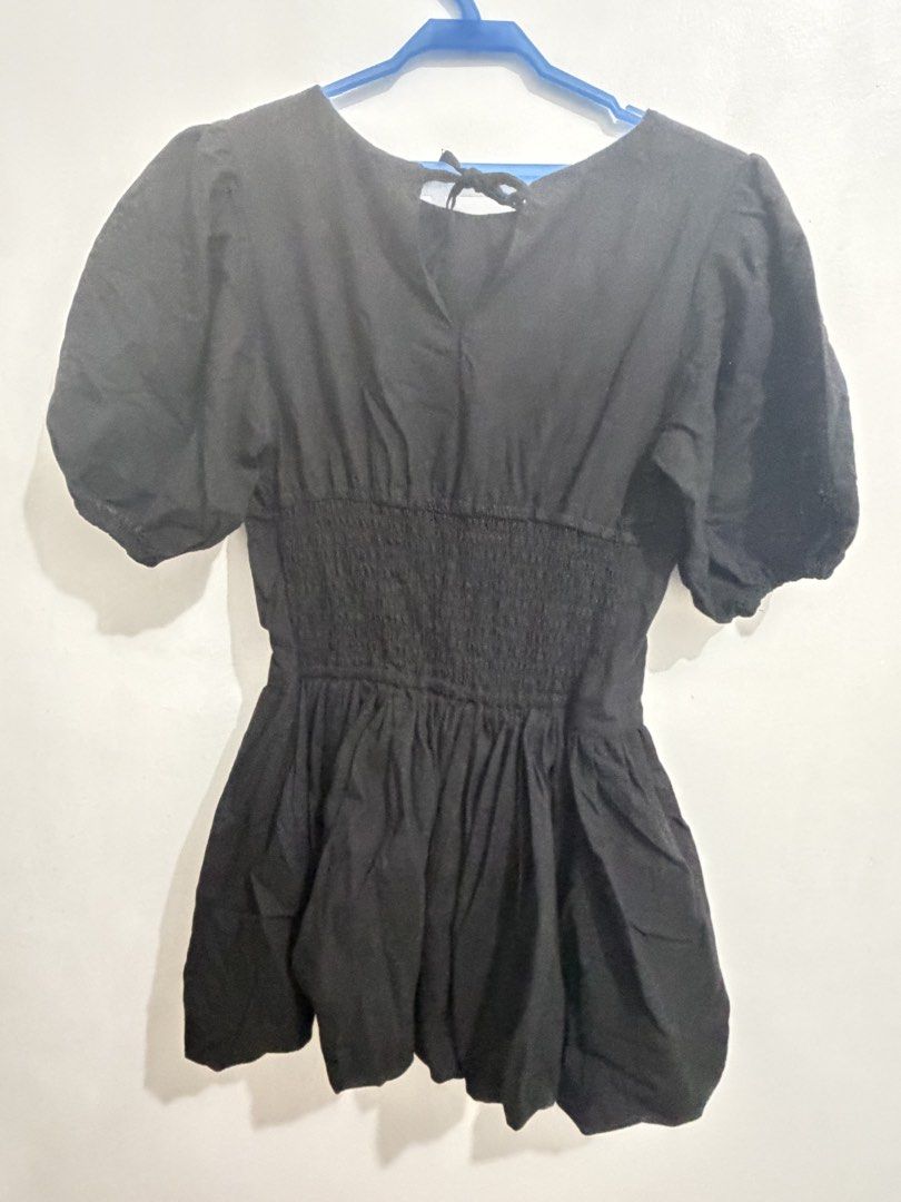 Black Puff Sleeve Bubble Dress Mini two way (Category: Dresses) located in Cainta. Submitted by selltimentalshop (Listing ID 1469932734, Image 3). Description: - Color: Classic Black - Sleeves: Trendy puff sleeves - Waist: Comfortable smocked elastic waistband - Design: Voluminous bubble skirt hem - Closure: Cute back tie near the neckline - Versatility: Perfect for casual outings and dates - Condition: Excellent Condition No issue Twice used onl