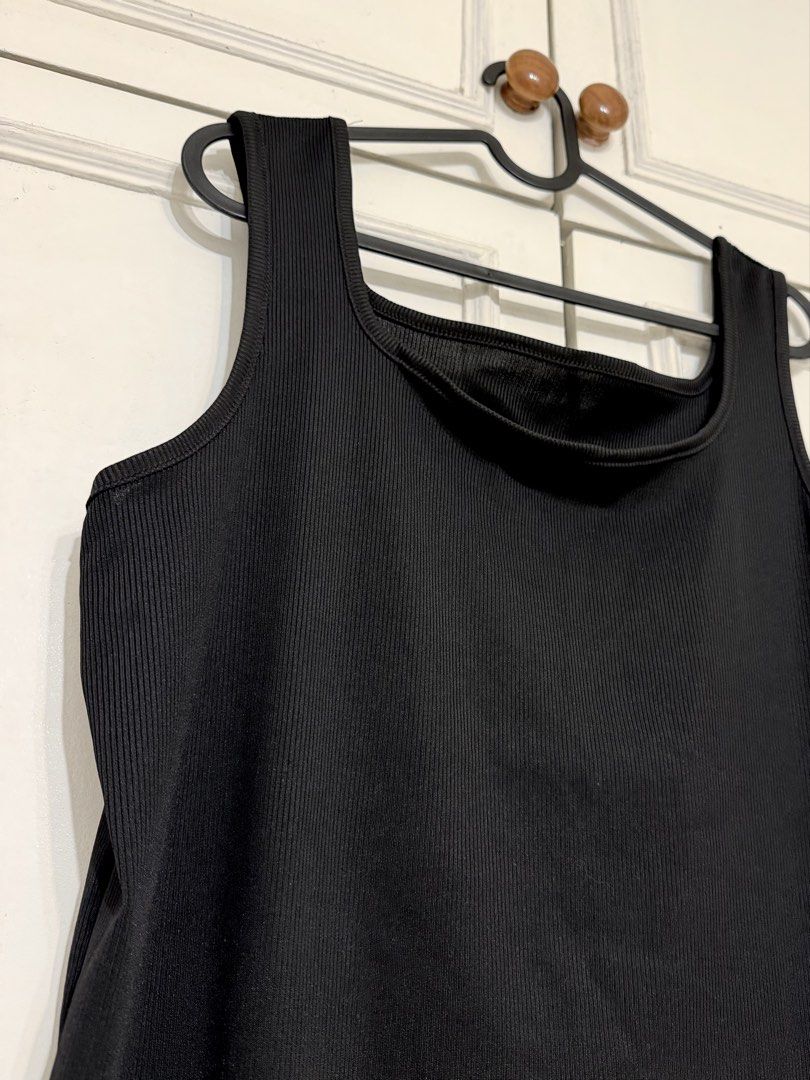 Black Ribbed Square Neck Tank Top (Category: Sleeveless) located in Rizal. Submitted by rianaht (Listing ID 1469931650, Image 2). Description: - Color: Black - Neckline: Square neck - Straps: Thick straps - Fabric: Stretchy and comfortable ribbed material - Versatile wardrobe staple that matches jeans, shorts, and skirts - Perfect for everyday casual wear 🌸 RFS: Decluttering 🌸 Delivery only to be shouldered by the buyer. 🌸 Payment via GCash / 
