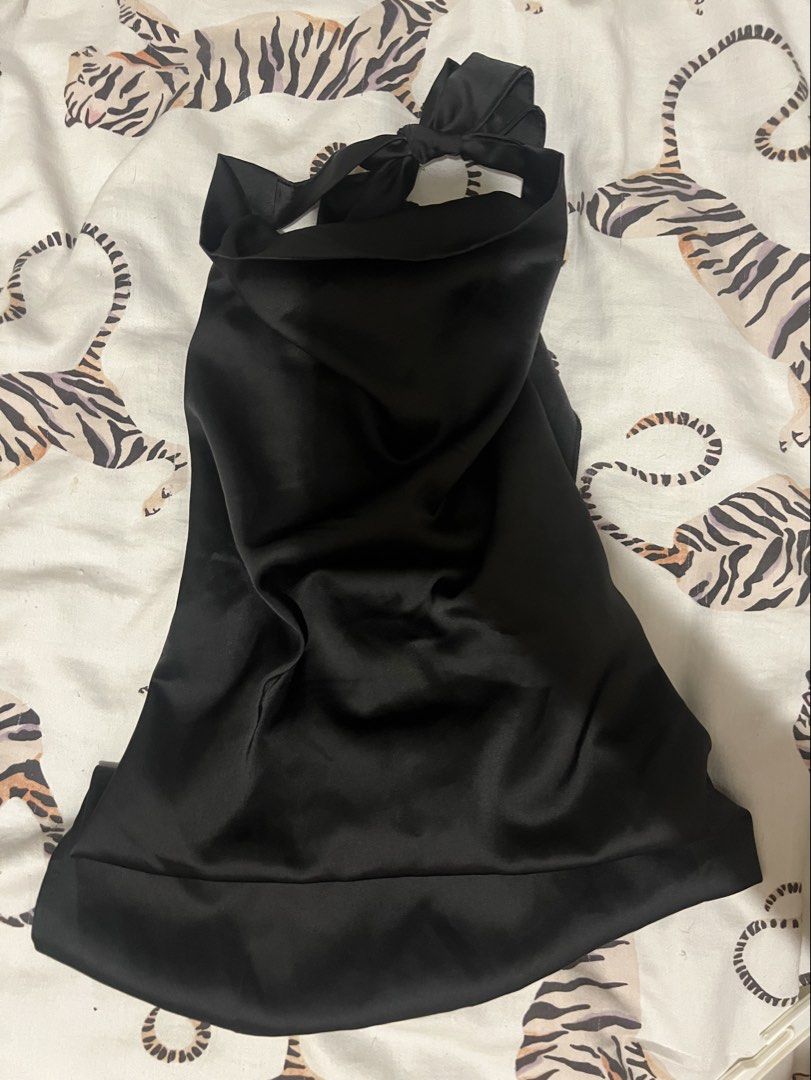 Black Satin backless Cowl Neck Halter Top (Category: Sleeveless) located in Makati City. Submitted by nat____ (Listing ID 1469878692, Image 2). Description: - Color: Sleek black - Material: Smooth, drapey satin - Neckline: Stylish cowl neck with knot detail - Back Design: Open back with adjustable silver-tone hardware straps - Versatile: Great for night outs or dressing up casual bottoms.