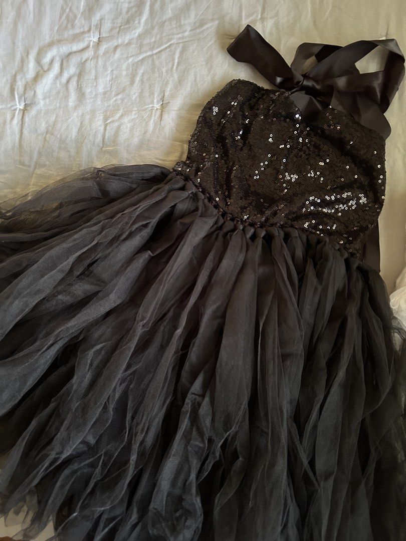 Black sequin cat costume set with ears, tail and bow (Category: Babies & Kids Fashion) located in Manila. Submitted by wildershores (Listing ID 1469876385, Image 1). Description: Black sequin dress with tulle skirt and satin halter neck ties. Includes a matching cat ear headband, tail with elastic loop, black bow tie, and lights to be worn under the skirt. Full set for Halloween and parties. Last photo shows the costume and lights when worn. Size