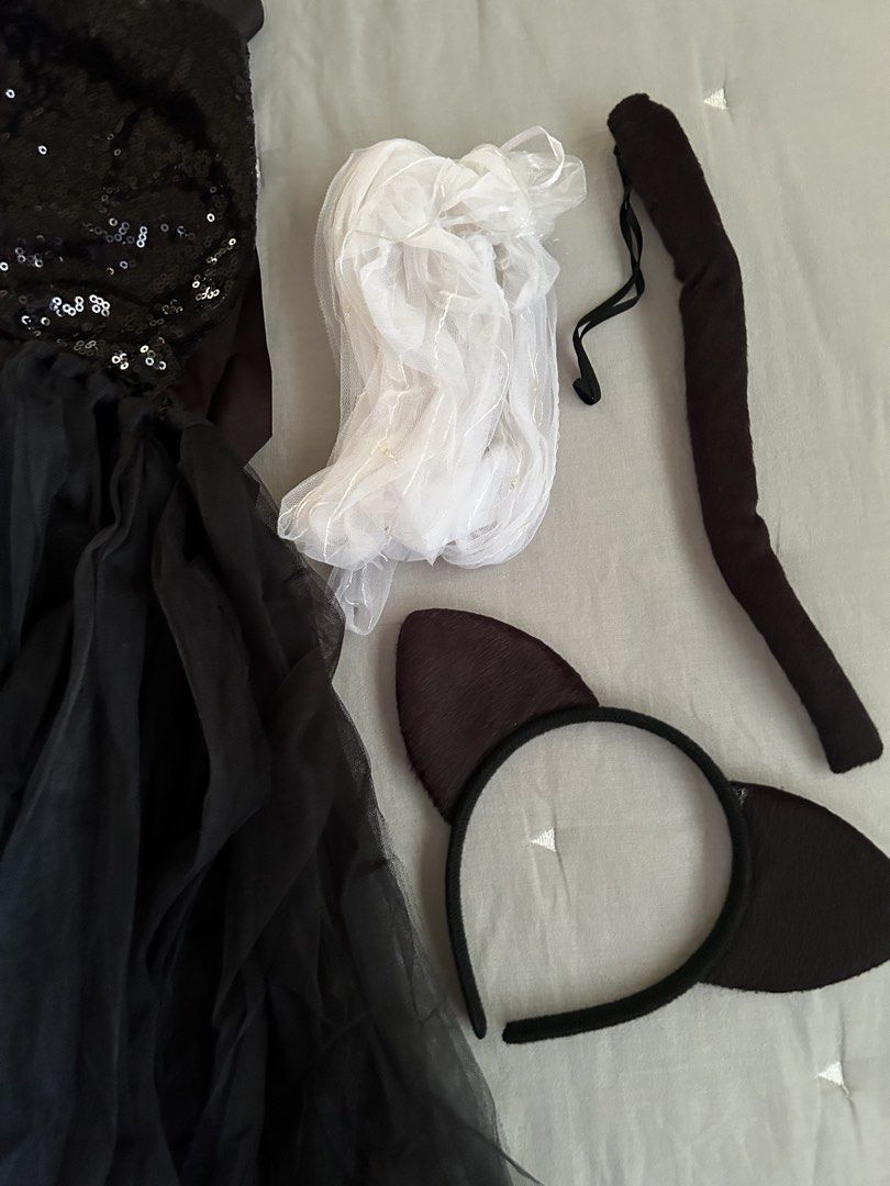 Black sequin cat costume set with ears, tail and bow (Category: Babies & Kids Fashion) located in Manila. Submitted by wildershores (Listing ID 1469876385, Image 3). Description: Black sequin dress with tulle skirt and satin halter neck ties. Includes a matching cat ear headband, tail with elastic loop, black bow tie, and lights to be worn under the skirt. Full set for Halloween and parties. Last photo shows the costume and lights when worn. Size