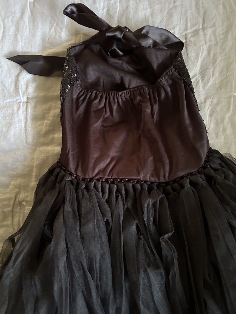 Black sequin cat costume set with ears, tail and bow (Category: Babies & Kids Fashion) located in Manila. Submitted by wildershores (Listing ID 1469876385, Image 2). Description: Black sequin dress with tulle skirt and satin halter neck ties. Includes a matching cat ear headband, tail with elastic loop, black bow tie, and lights to be worn under the skirt. Full set for Halloween and parties. Last photo shows the costume and lights when worn. Size