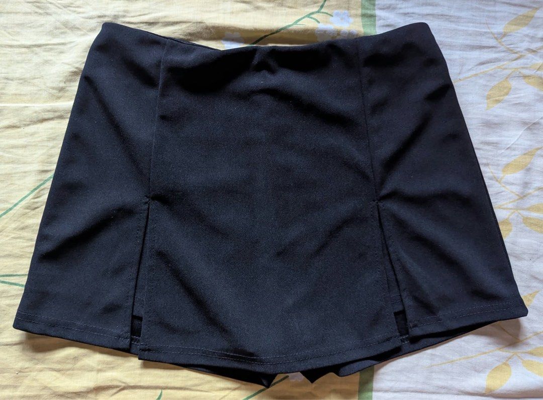 Black Skort with Front Slits (Category: Skirts) located in Quezon City. Submitted by thegoodkarmaph (Listing ID 1469834368, Image 1). Description: - Color: Solid black (goes with everything) - Design: Skirt overlay with built-in shorts underneath - Details: Chic front slits on both sides - Fit: High-waisted with a comfortable elastic waistband at the back - Material: Smooth, easy-to-style fabric - Styling: Perfect for pairing with casual tees or 