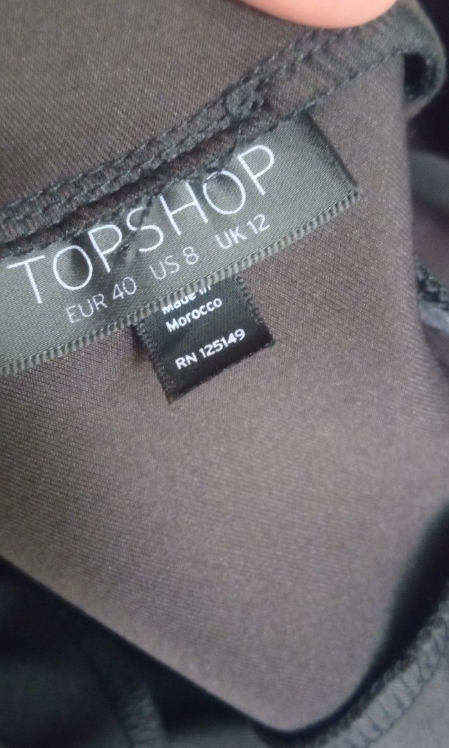 Topshop Black sleeveless peplum dress (Category: Dresses) located in Manila. Submitted by charlottej01596 (Listing ID 1469789996, Image 2). Description: - Color: Black - Style: Sleeveless peplum dress with a pencil skirt bottom - Neckline: Round front, deep V-back with zipper closure - Fit: Structured with darting details, knee-length - Fabric: Smooth and clean silhouette - Occasion: Ideal for work or evening events.