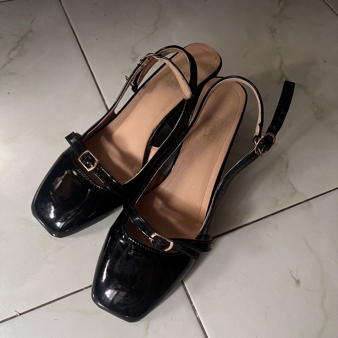 Black slingback block heels with buckle strap (Category: Heels) located in Manila. Submitted by prelovedpick.com (Listing ID 1469816177, Image 1). Description: - Color & Finish: Glossy black patent - Toe Shape: Trendy square toe - Heel: Comfortable low block heel for all-day wear - Design: Slingback with small gold-toned buckle and cute front bow accent - Interior: Tan inner lining - Condition: Worn only a few times, minimal wear on soles - Versa