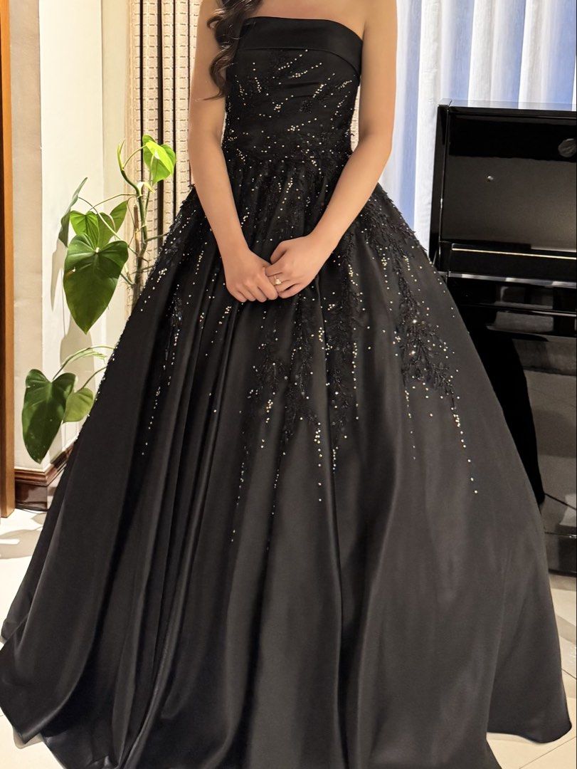Black strapless ball gown with beading and glitter (Category: Evening dresses & gowns) located in Manila. Submitted by denise805 (Listing ID 1469887191, Image 3). Description: - Elegant black strapless gown with a dramatic, voluminous skirt - Features sparkling beading and delicate floral lace appliques on the bodice and skirt - Satin-like fabric with a gorgeous silhouette and sheen - Worn only once for a special occasion.