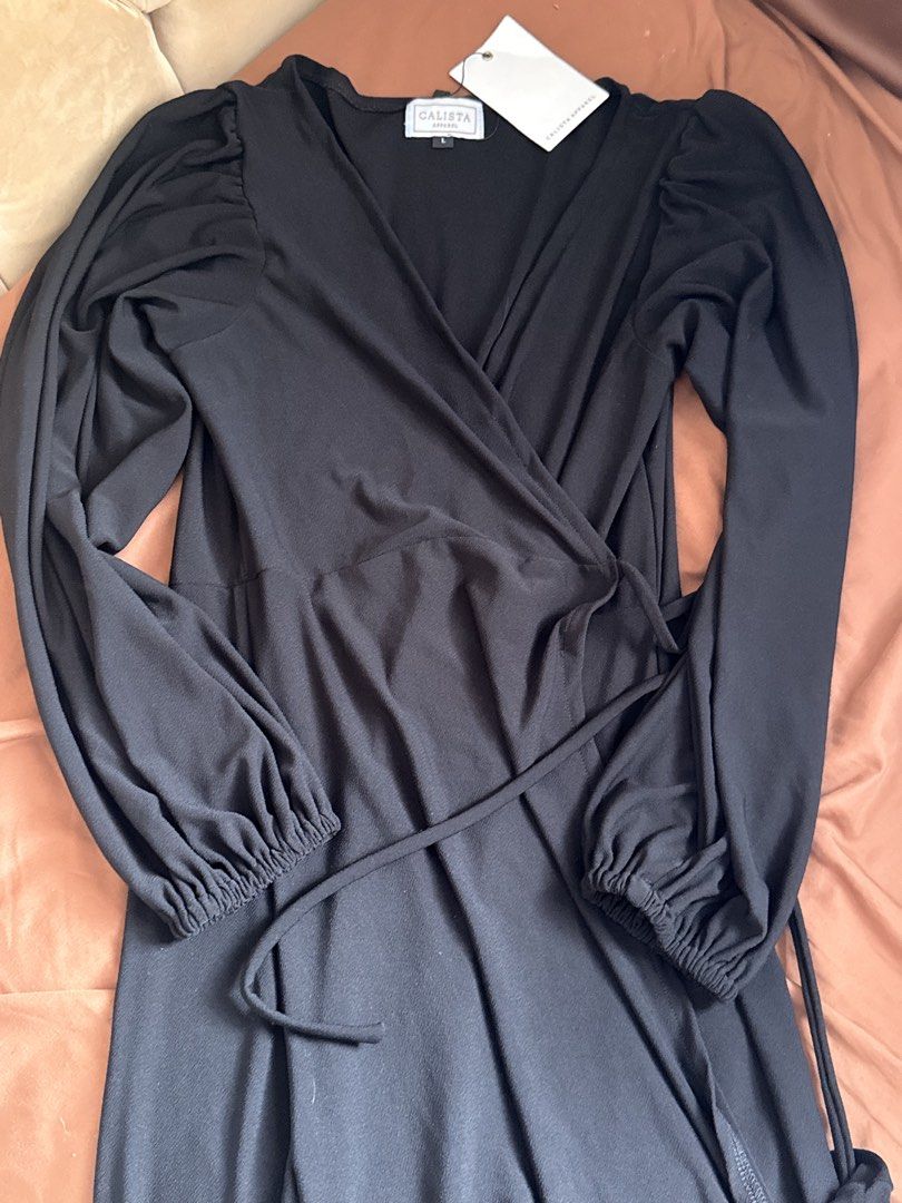 Black Wrap Around Dress (Category: Dresses) located in Cainta. Submitted by vnncassandra (Listing ID 1469870924, Image 2). Description: Brand new with Tag Perfect for office/ events .