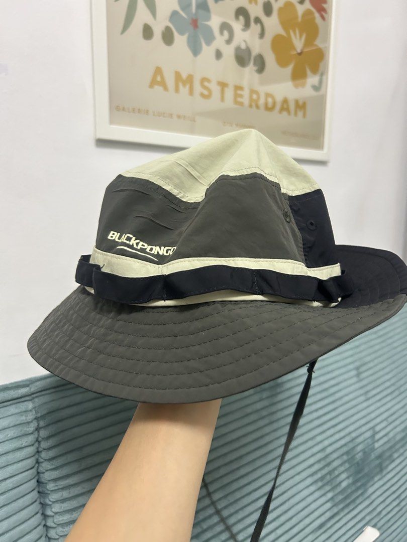Blackpongo Two-Tone Bucket Hat (Category: Caps & Hats) located in Cavite. Submitted by _schmyla (Listing ID 1469888015, Image 2). Description: - Brand: Blackpongo - Color: Khaki and dark grey panels with a contrasting black strap - Features: Adjustable chin cord for windy days, inner sweatband - Condition: Tag intact - Ideal for: Hiking, camping, and daily casual wear.
